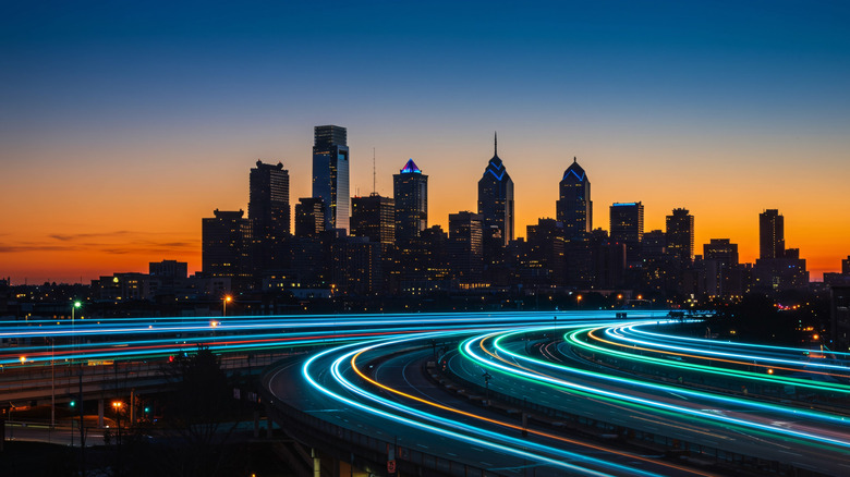 Band lights over modern urban cityscape at night