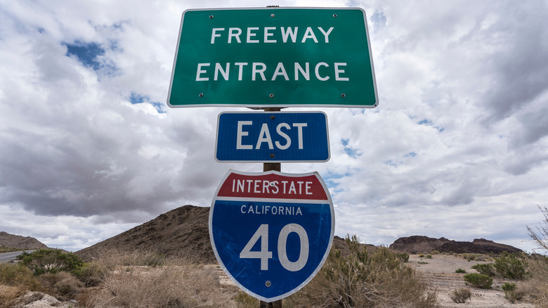 Road signs marking the freeway entrance to Interstate 40 east out of California