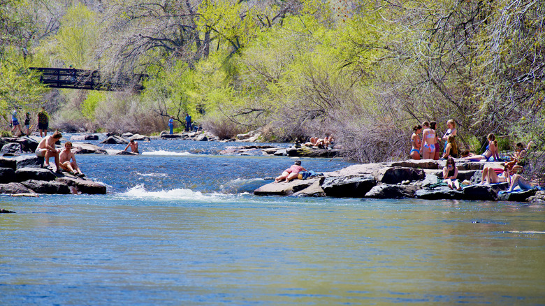 people bathing in Clear Creek in Golden Colorado