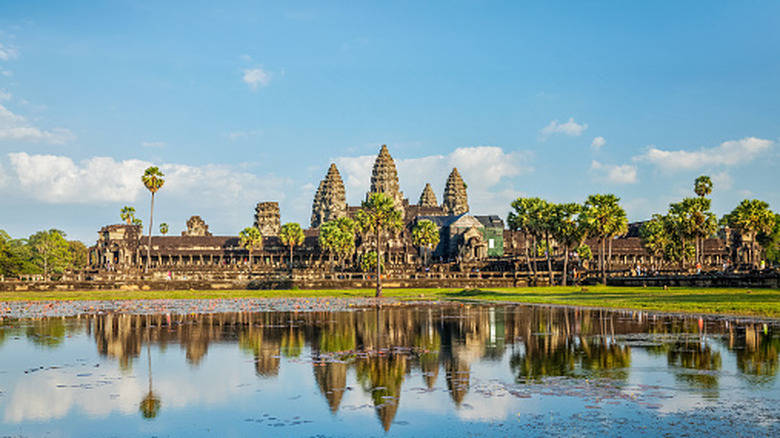 Temples of Angkor Wat with reflection in a lake in front