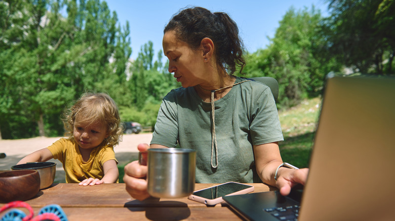 digital nomad parent with child