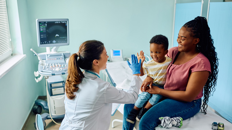 family with child visiting doctor