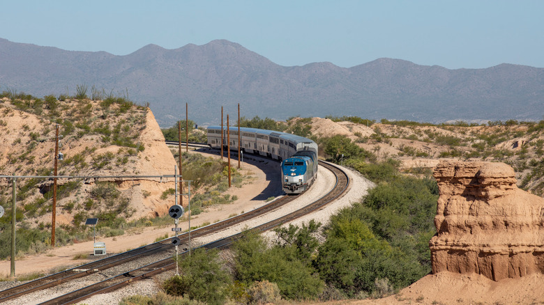 Amtrak train crosses desert landscape