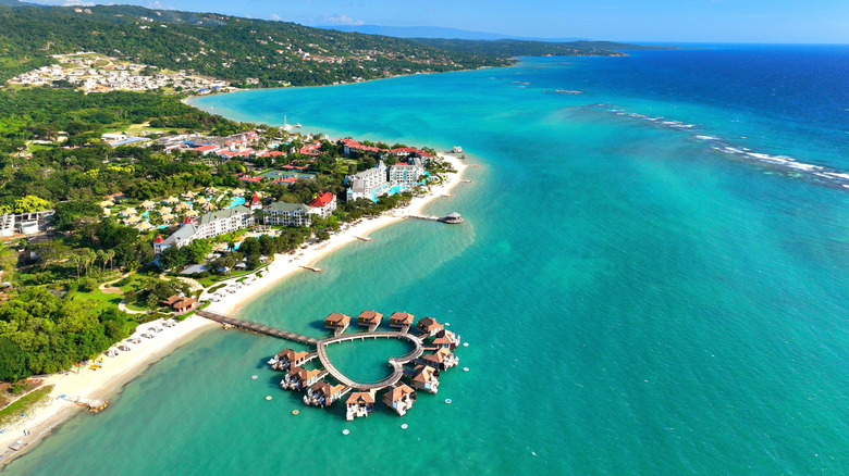 An aerial view of the heart-shaped overwater bungalows at Sandals South Coast Hotel.