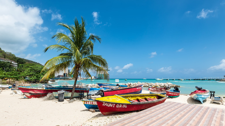 Fishing boats line the beach at Ocho Rios, Jamaica.