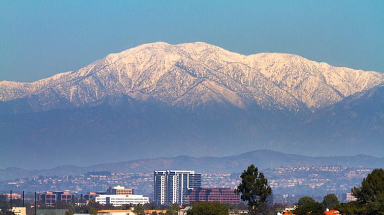 A scenic view of Mt. Baldy with the city below in Southern California.