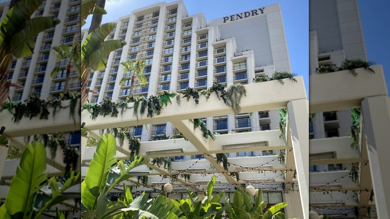 Tiered, greenery-decorated exterior of Pendry Hotel in Newport Beach, California.