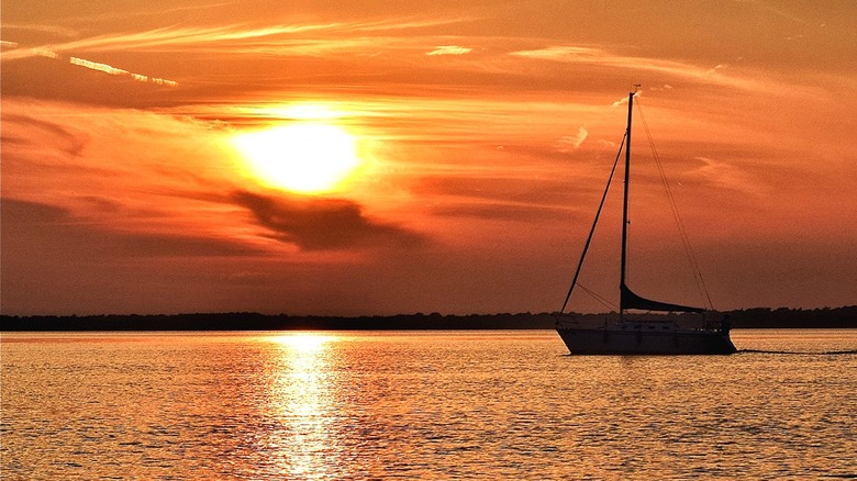 sailboat on Petenwell Lake at sunset