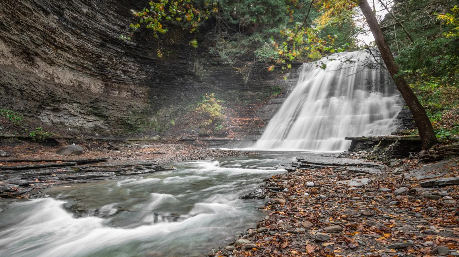 This Scenic New York State Park Boasts Waterfall Hikes And Natural Swimming Areas

