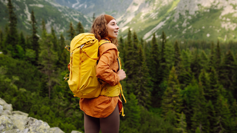 modern hiker in synthetic clothing
