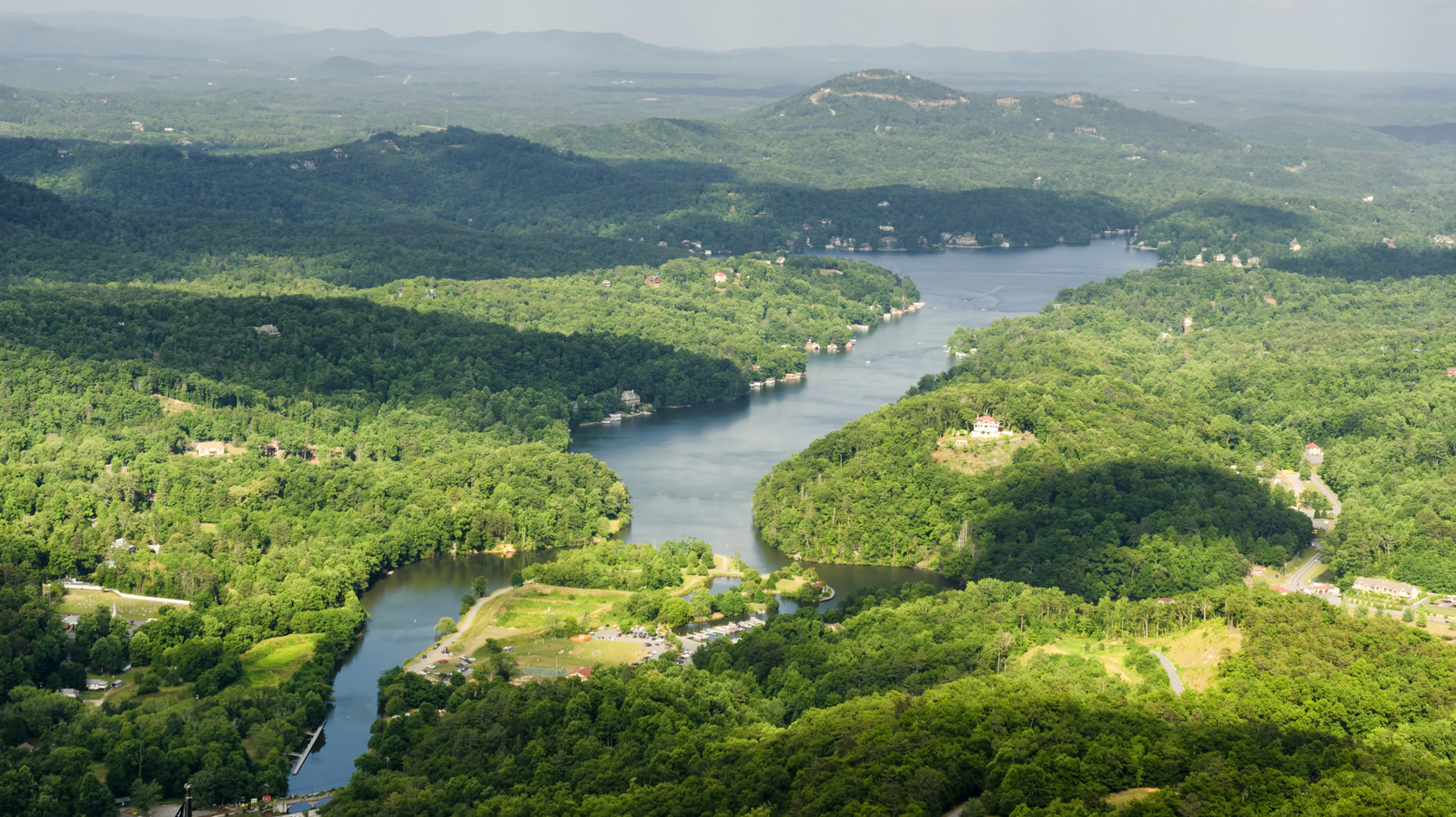 North Carolina's Cinematic Mountain Lake Offers Flower-Draped Gardens And Hidden Coves

